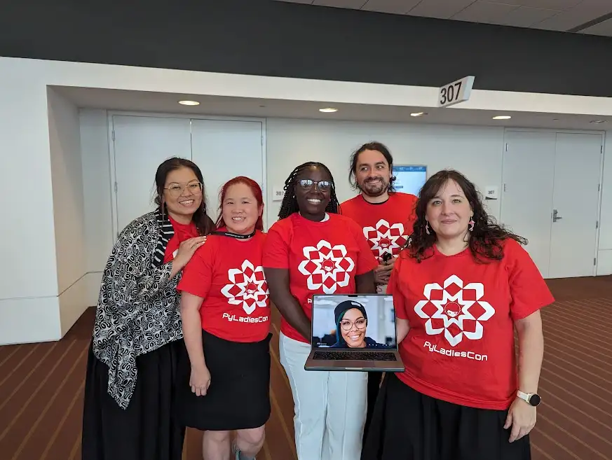 PyLadiesCon team members wearing PyLadiesCon T-shirts at PyCon US